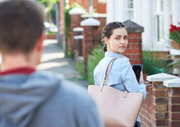 a woman being followed by a stalker